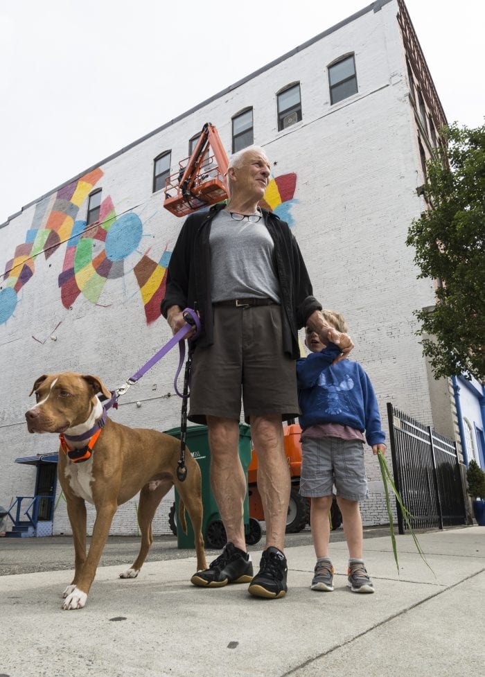 Pilot the dog, Alf Wilson, and Cooper Wilson, 5, both of Marblehead a came to see the mural festival on Friday. Both are related to Al Wilson, who organized the festival.