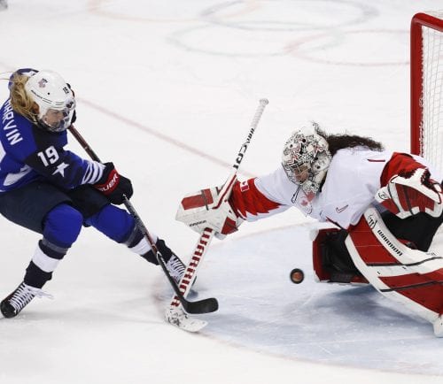Gigi Marvin (19), of the United States, scores a goal against goalie Shannon Szabados (1), of Canada, in the penalty shootout during the women's gold medal hockey game at the 2018 Winter Olympics in Gangneung, South Korea, Thursday, Feb. 22, 2018.