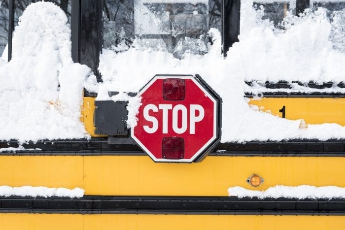 A Lynn school bus waits to be cleared of snow following the storm on Wednesday.