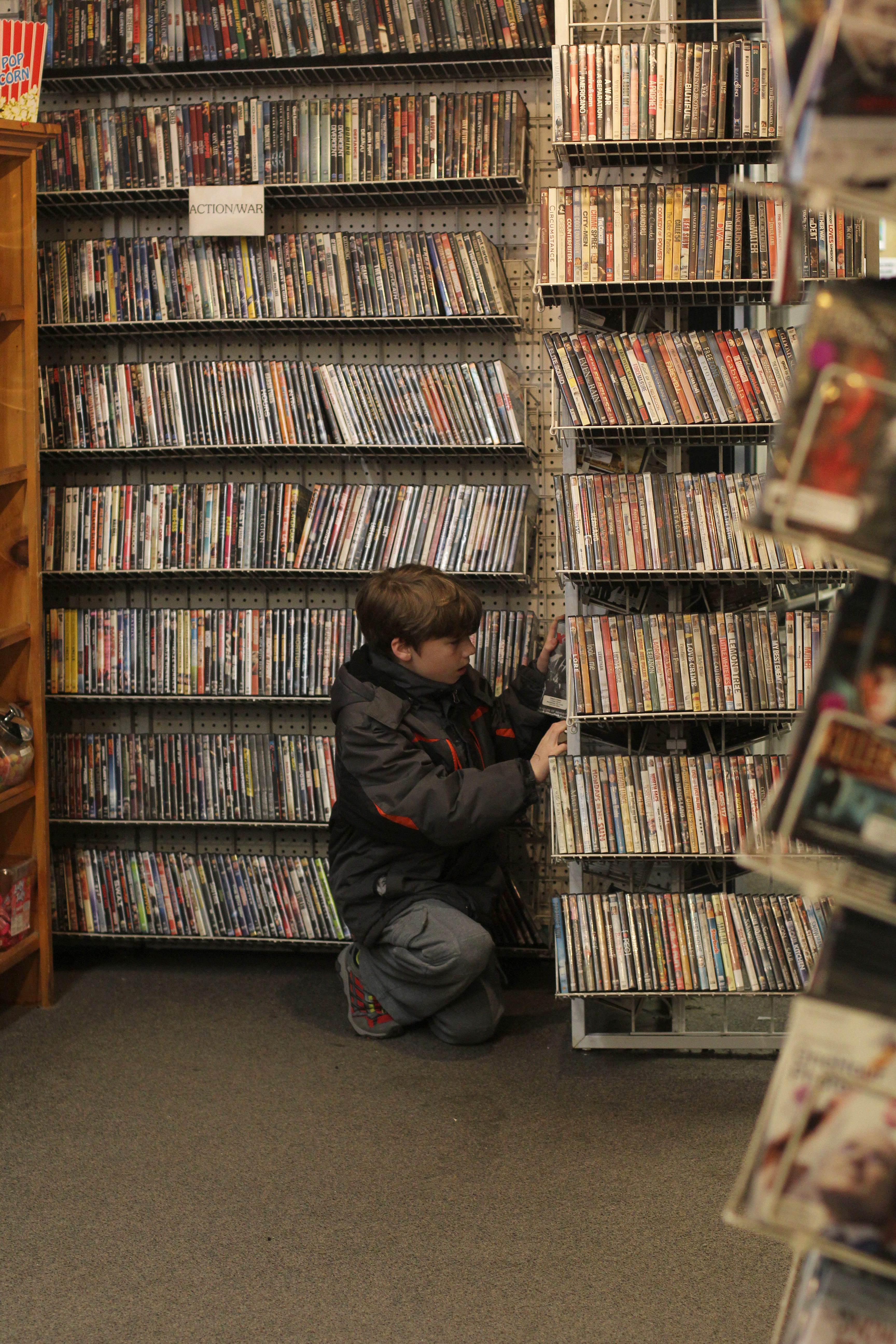 Marblehead, Ma. 3-1-18. Cole Goodwin shopping for a video in Chet's Video and Candy Shoppe in Marblehead.