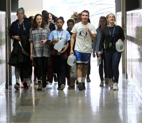 Swampscott, Ma. 3-22-18. Chrissy Rogers, Marley Schmidt, Mahder Teferra, Reece Klusza, and Mariel Flughum walk for water around the halls of Swampscott High School on World Water Day.