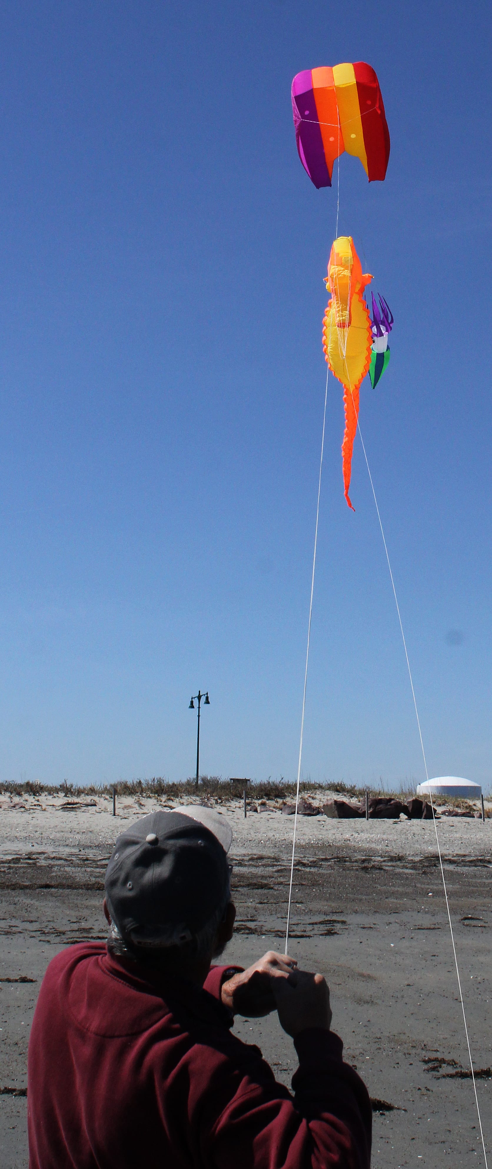 Lynn, Ma. 4-23-18. Richie Salvo puts kites in the air on Long Beach.