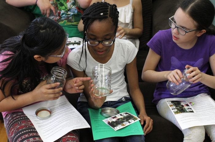 Lynn, Ma. 5-3-18. Hailley Mendez, left, Laisha Mercedes, and Jasmin Guzman look at their jars which they will use to build a salad at Girl's Inc.