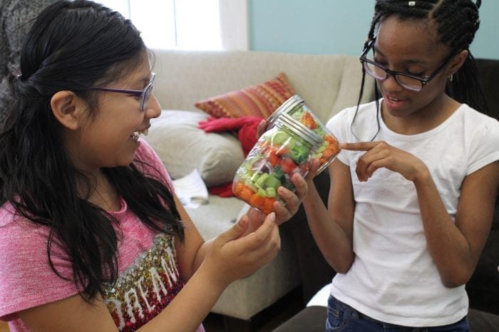 Lynn, Ma. 5-3-18. Hailley Mendez, left, and Laisha Mercedes with their newly created salad in a jar at Girl's Inc.